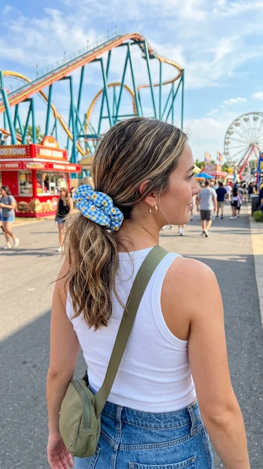 20 Hairstyles for Amusement Parks That Survive Rides and Heat 18 Low Ponytail With Scrunchie